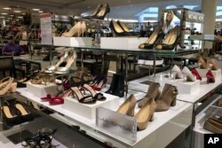 FILE - Photo shows shoes including Ivanka Trump brand shoes being sold at a Macy's store.