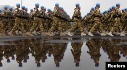 FILE - Indonesia's U.N peacekeeping force marches during a ceremony to commemorate the 65th military anniversary at a base in Jakarta, Oct. 5, 2010.