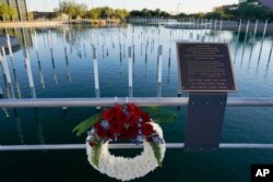 A Veterans Day wreath left Nov. 11, 2020, in Scottsdale, Ariz., at the USS Arizona Memorial Gardens, a site honoring each of the ship's 1,512 crew members, including the 1,177 who died at Pearl Harbor.