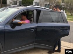 Ride-hailing driver Percy Saloman, picking up a fare in Northern Virginia on March 17, 2020, is driving longer hours for less money.
