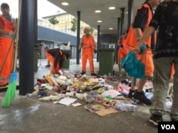 Workers cleaning up Budapest's Keleti station after Hungary started bussing migrants to the Austrian border. (Luis Ramirez/VOA)