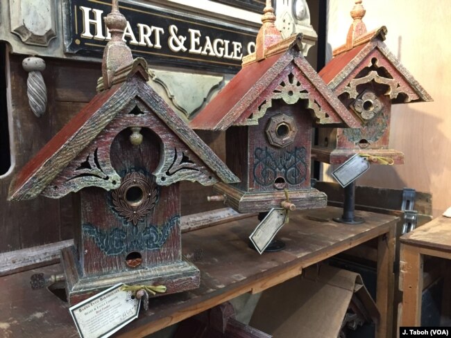 Artisan John Guertin combines his love of architecture and the environment by creating one-of-a-kind birdhouses and feeders using wood from century-old barns from his home state of Michigan.