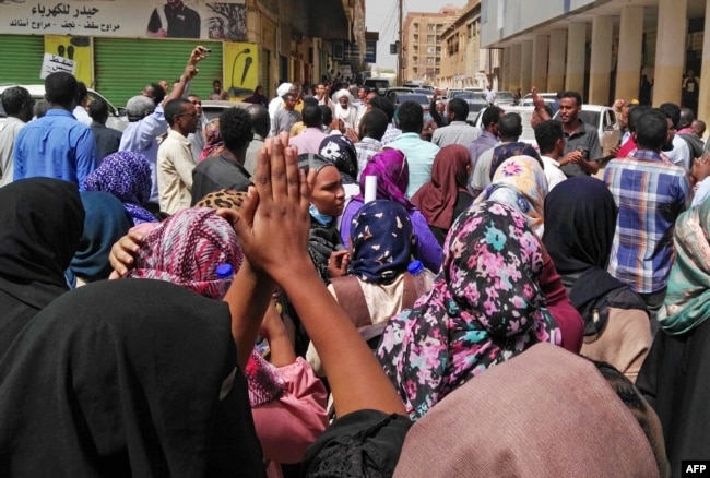 Sudanese protesters take part in an anti-government demonstration in Khartoum, Feb. 14, 2019.