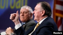 FILE - Jack Keane, with fellow retired U.S. Army General Richard Cody in the background, speaks at the annual Skybridge Alternatives Conference (SALT) in Las Vegas, May 10, 2013.