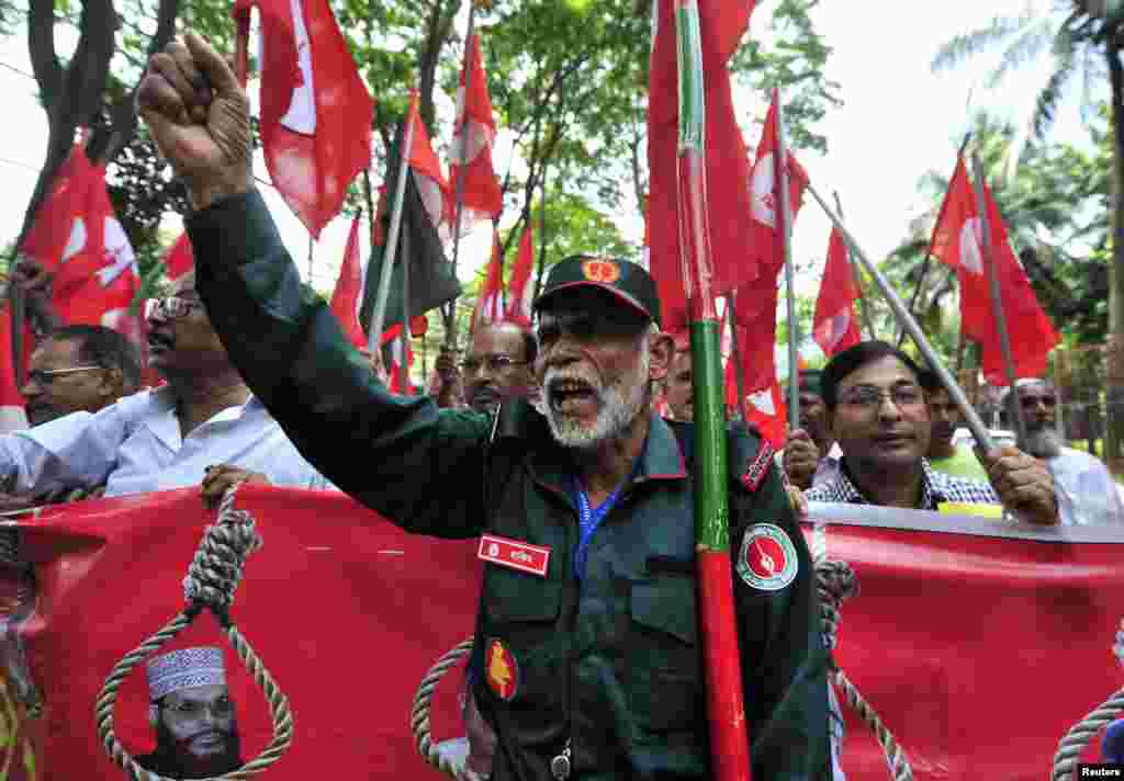 Members of Bangladesh Muktijoddha Sangsad shout slogans after a war crimes tribunal sentenced Ali Ahsan Mohammad Mujahid to death, July 17, 2013.