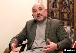 FILE - Haneef Atmar, former Afghan national security adviser and candidate in upcoming presidential elections, speaks during an interview in Kabul, Afghanistan, Feb. 23, 2019.