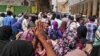 FILE - Sudanese protesters take part in an anti-government demonstration in Khartoum, Feb. 14, 2019. 