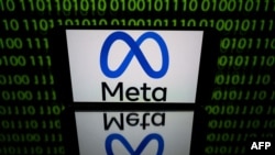 FILE - This picture taken on Jan. 12, 2023 in Toulouse, southwestern France shows a tablet displaying the logo of the company Meta.