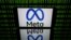 FILE - This picture taken on Jan. 12, 2023 in Toulouse, southwestern France shows a tablet displaying the logo of the company Meta.