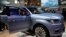FILE - A man steps out from a Lincoln Navigator SUV on display at the China Auto Show in Beijing, April 25, 2018. Used, once-leased Lincoln vehicles are among the cars available as subscriptions in San Francisco.