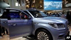 FILE - A man steps out from a Lincoln Navigator SUV on display at the China Auto Show in Beijing, April 25, 2018. Used, once-leased Lincoln vehicles are among the cars available as subscriptions in San Francisco.