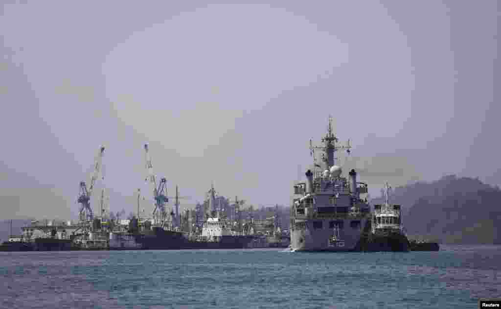 Indian Navy ship INS Kesari, involved in search operations for the missing Malaysia Airlines Flight MH370, arrives at the naval base in Port Blair, the capital of India's Andaman and Nicobar islands, March 17, 2014. 