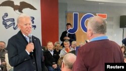 Democratic 2020 U.S. presidential candidate and former U.S. Vice President Joe Biden faces off with a local resident challenging him about his son's involvement with Ukraine in a video screengrab during a campaign event in New Hampton, Iowa, Dec. 5, 2019.