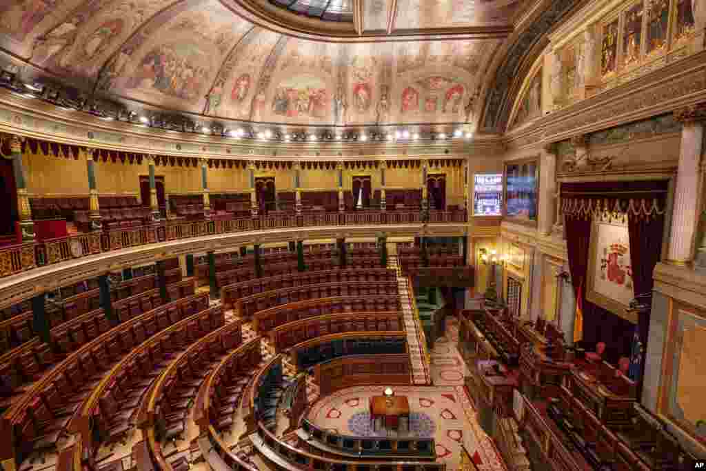 The seats are empty in Spanish Parliament&#39;s lower house in Madrid because the chamber canceled its activities for a week after a prominent lawmaker from the upstart far-right Vox party tested positive for the COVID-19 disease.