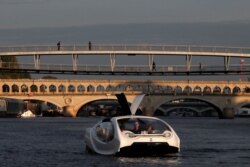 The Bubbles water taxi is seen on the River Seine during a demonstration by the SeaBubbles company in Paris, France, Sept. 16, 2019.
