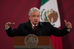 FILE - In this Dec. 18, 2020 file photo, Mexican President Andres Manuel Lopez Obrador gives his daily, morning news conference at the presidential palace, Palacio Nacional, in Mexico City.