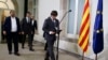 Catalonia regional President Carles Puigdemont arrives for a statement after signing the decree officially calling for the vote on a binding independence referendum, following a plenary session at the Parliament of Catalonia in Barcelona, Spain, Sept. 6, 2017.