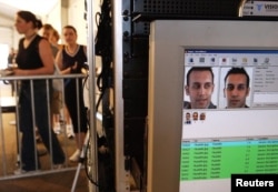 FILE - Facial recognition technology is used to screen people before they visit the Statue of Liberty in New York, US.