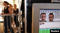 FILE - Facial recognition technology is used to screen people before they visit the Statue of Liberty in New York, US.