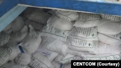 Sacks of ammonium perchlorate, a chemical commonly used to make missile fuel, are found on a fishing vessel intercepted by U.S. naval forces in the Gulf of Oman in November 2022. 