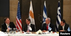 Israeli Prime Minister Benjamin Netanyahu, U.S. Secretary of State Mike Pompeo, Greek Prime Minister Alexis Tsipras and Cypriot President Nicos Anastasiades chat during their meeting in Jerusalem, March 20, 2019.