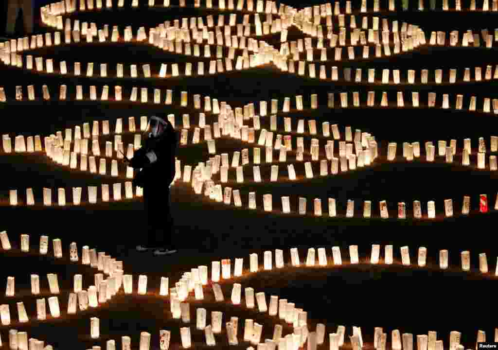 Paper lanterns are lit for the victims of the March 11, 2011, earthquake and tsunami disaster that killed thousands and led to the worst nuclear accident since Chernobyl, in Tokyo, Japan.