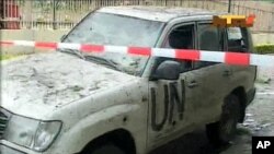 A damaged U.N. vehicle after a bomb blast at the United Nations offices in the Nigerian capital of Abuja August 26, 2011.