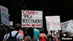 FILE - People gather for an anti-vaccine rally, amid the coronavirus pandemic, in Central Park, New York City, July 24, 2021. 
