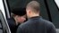 Army Pfc. Bradley Manning is escorted into a courthouse for his court marial at Fort Mead, Maryland, July 25, 2013. 