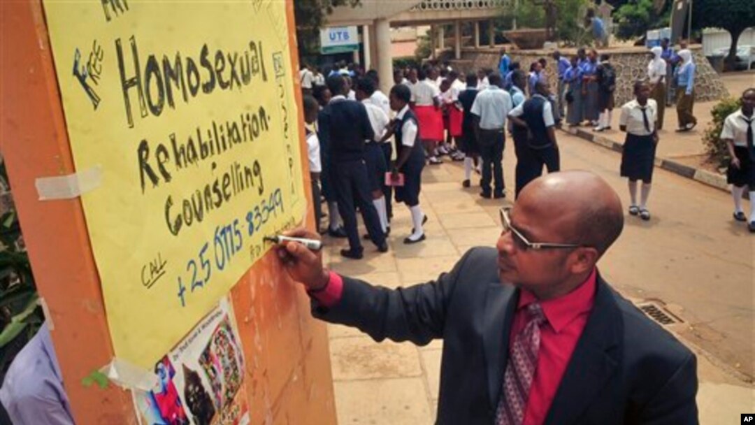 Ugandan anti-gay activist Pastor Martin Ssempa posts public notice offering "rehabilitation" for homosexuals, National Theater, Kampala, Feb. 25, 2014.