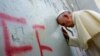 Papa Francisco junto aomuro que divide Isarel e a Cisjordania