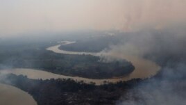 An aerial view shows smoke rising into the air around the Cuiaba river in the Pantanal, the world's largest wetland, in Pocone, Mato Grosso state, Brazil, August 28, 2020. REUTERS/Amanda Perobelli