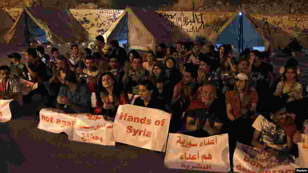 Supporters of Syria's President Bashar al-Assad take part in "Over our Bodies", a campaign to organize human shields against possible U.S. strikes, at Qasion Mountain overlooking the capital Damascus, Sept. 2, 2013.