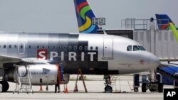 FILE - A Spirit Airlines airplane sits on the tarmac at Fort Lauderdale-Hollywood International Airport in Fort Lauderdale, Florida.