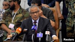 Perdana Menteri Libya Ali Zeidan berbicara dalam upacara pengesahan undang-undang pemilu di Al Bayda, 20 Juli lalu.