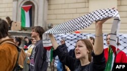 Demonstrators stage a protest at the Warsaw University campus to demand that the University authorities publicly condemn Israel's invasion of Gaza and cut cooperation with Israeli academic institutions in Warsaw on June 12, 2024. (Photo by Wojtek Radwansk