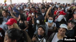 People gather in the aftermath of the last days' protests, after the government of Ecuadorian President Lenin Moreno agreed to repeal a decree that ended fuel subsidies, in Quito, Ecuador October 14, 2019.