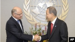 Argentine Foreign Minister Hector Timerman, left, meets with U.N. Secretary-General Ban Ki-moon, at the U.N., New York, February 10, 2012.