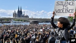 Thousands of people demonstrate in Cologne, Germany, June 6, 2020, to protest against racism and the recent death of George Floyd in police custody in Minneapolis, Minn.