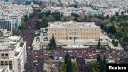 A drone view shows people gathering in front of the Greek parliament during a protest, marking the second anniversary of the country's worst railway disaster, while an investigation continues, in Athens, Greece, Feb. 28, 2025. (Eurokinissi via Reuters) 