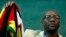 FILE - Zimbabwean Pastor Evan Mawarire holds his country's flag before addressing supporters at the University of the Witwatersrand in Johannesburg, South Africa, July 28, 2016.