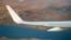 FILE - Air Force One, carrying President Barack Obama, flies over the island village of Kivalina, an Alaska Native community of 400 people already receding into the ocean as a result of rising sea levels, on its way to Ralph Wien Memorial Airport, Sept. 2, 2015, in Kotzebue, Alaska.