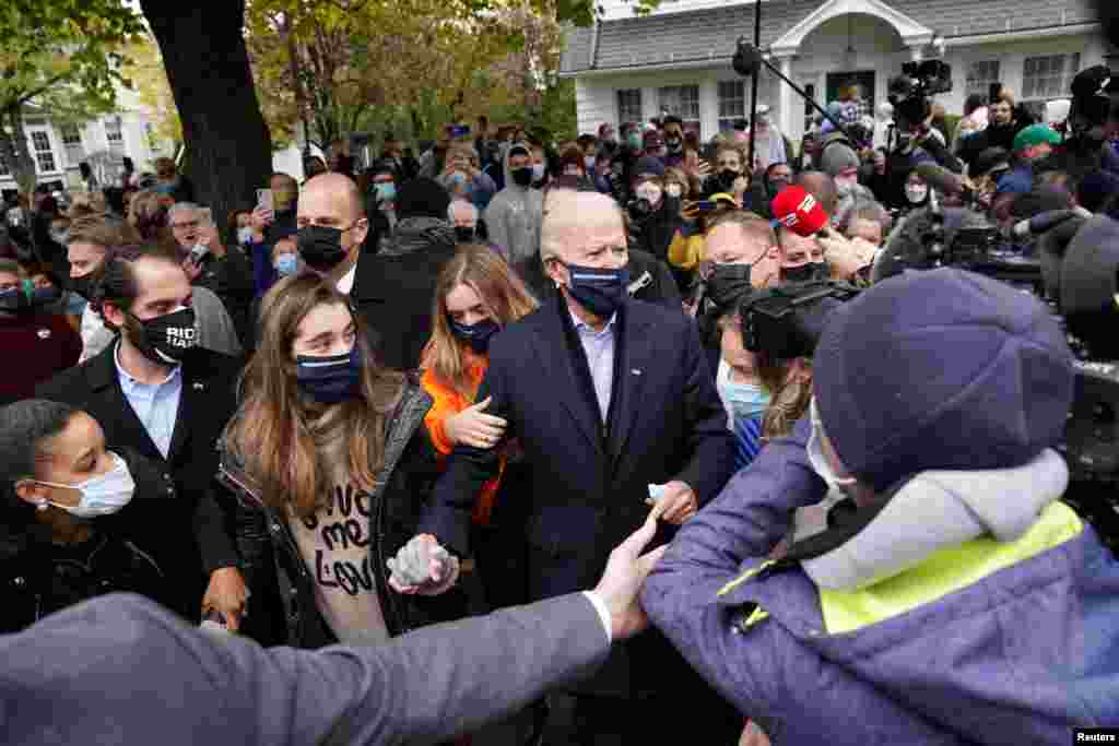 U.S. Democratic presidential nominee Joe Biden makes his way through the crowd outside of his childhood home on Election Day in Scranton, Pennsylvania, Nov. 3, 2020. 