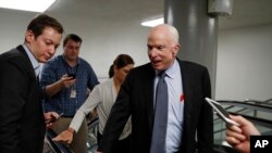 Sen. John McCain, R-Ariz., talks to reporters on Capitol Hill in Washington, Wednesday, Oct. 18, 2017. 