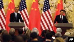 U.S. President Barack Obama, left, speaks next to Chinese President Xi Jinping during their joint press conference at the Great Hall of the People in Beijing Wednesday, Nov. 12, 2014.