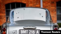 Handout photo shows a raised rear bullet-proof screen of an original Aston Martin DB5 James Bond car.