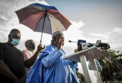 Mahmoud Dicko, an imam who has helped lead the movement against President Ibrahim Boubacar Keita, addresses Malians supporting the recent overthrow of Keita as they gather to celebrate in the capital, Bamako, Aug. 21,