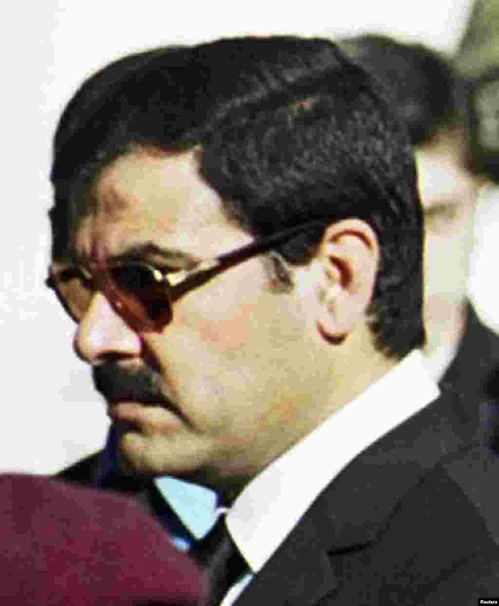 Assef Shawkat, brother-in-law of Syrian President Bashar al-Assad, who was assassinated in Damascus, stands during the funeral of late president Hafez al-Assad in this June 13, 2000 photo.