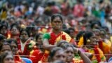 Devotees with their mouths pierced with tridents participate in a ritual to worship the Hindu goddess Durga during Aadi festival celebrations in the southern Indian city of Chennai.