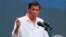FILE - Philippine President Rodrigo Duterte gestures during his address to a Filipino business sector in suburban Pasay city south of Manila, Philippines.